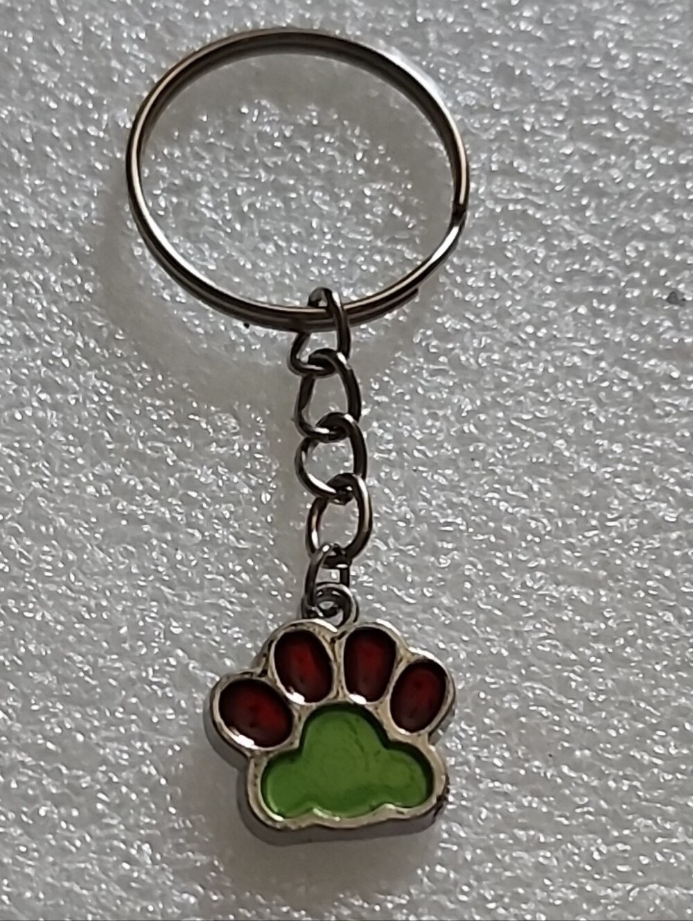 Hand Crafted Silver Keychain with Green and Red Paw Charm